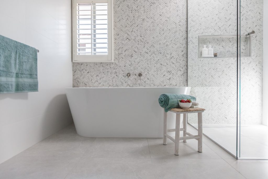 modern bathroom designs herringbone tile feature wall at she's got style interior designer
